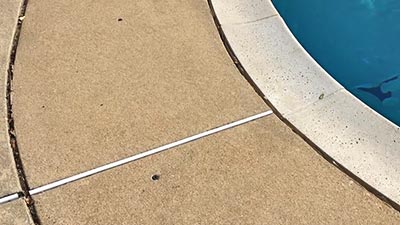 Swimming pool surrounds mudjacking raised and repaired