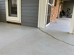 Sunken porch cracked concrete - before repair